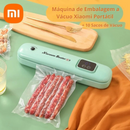 máquina de vácuo verde com linguiça